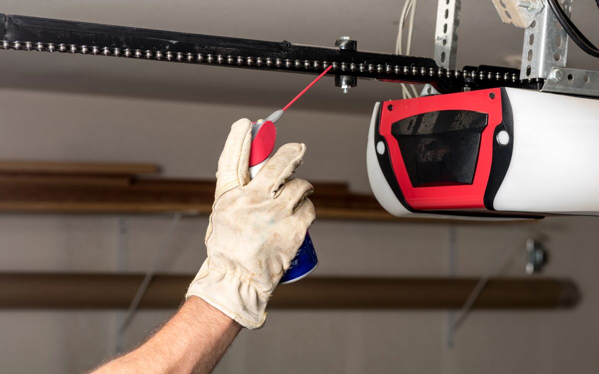Lubricating a garage door opener chain during a tune-up